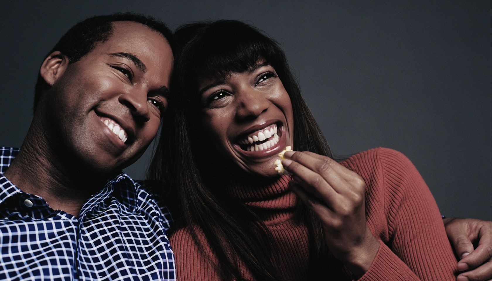 Laughing Couple Watching Movie