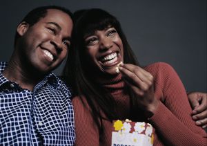 Laughing Couple Watching Movie