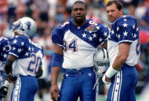 HONOLULU, HI - FEBRUARY 5:  Dallas Cowboys defensive end Charles Haley #94 and tight end Jay Novacek of the NFC Team looks on during the 1995 NFL Pro Bowl at Aloha Stadium on February 5, 1995 in Honolulu, Hawaii.  The AFC defeated the NFC 41-13.  (Photo by George Rose/Getty Images)