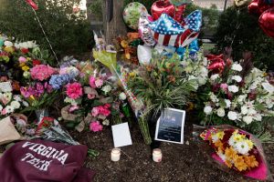 ROANOKE, VA - AUGUST 26: Flowers are left for the two journalists that were killed this morning during a live broadcast on August 26, 2015 in Roanoke, Virginia. Two employees of WDBJ TV were killed this morning during a live broadcast at Bridgewater Plaza on Smith Mountain Lake. The victims have been identified as reporter Alison Parker and cameraman Adam Ward. Parker, 24 and Ward, 27, worked for WDBJ in Roanoke, Virginia. The suspect, Vester Lee Flanigan, also known as Bryce Williams, died of a self-inflicted gunshot wound. (Photo by Jay Paul/Getty Images)