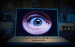 Man's eye on lap top computer