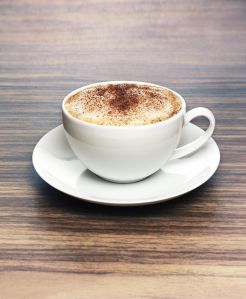 Coffee cup on wooden surface