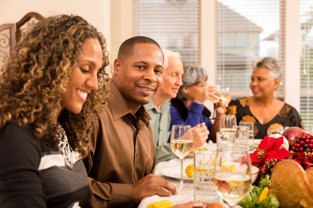 Relationships: Family and friends gather for Christmas dinner party.