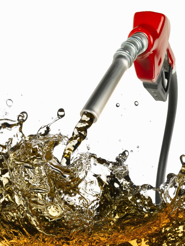 Gasoline pump handle with gas pouring out (Digital Composite)