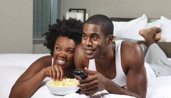 African American Couple Watching a Movie at Home