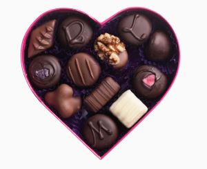 Close up of chocolates in heart-shape box
