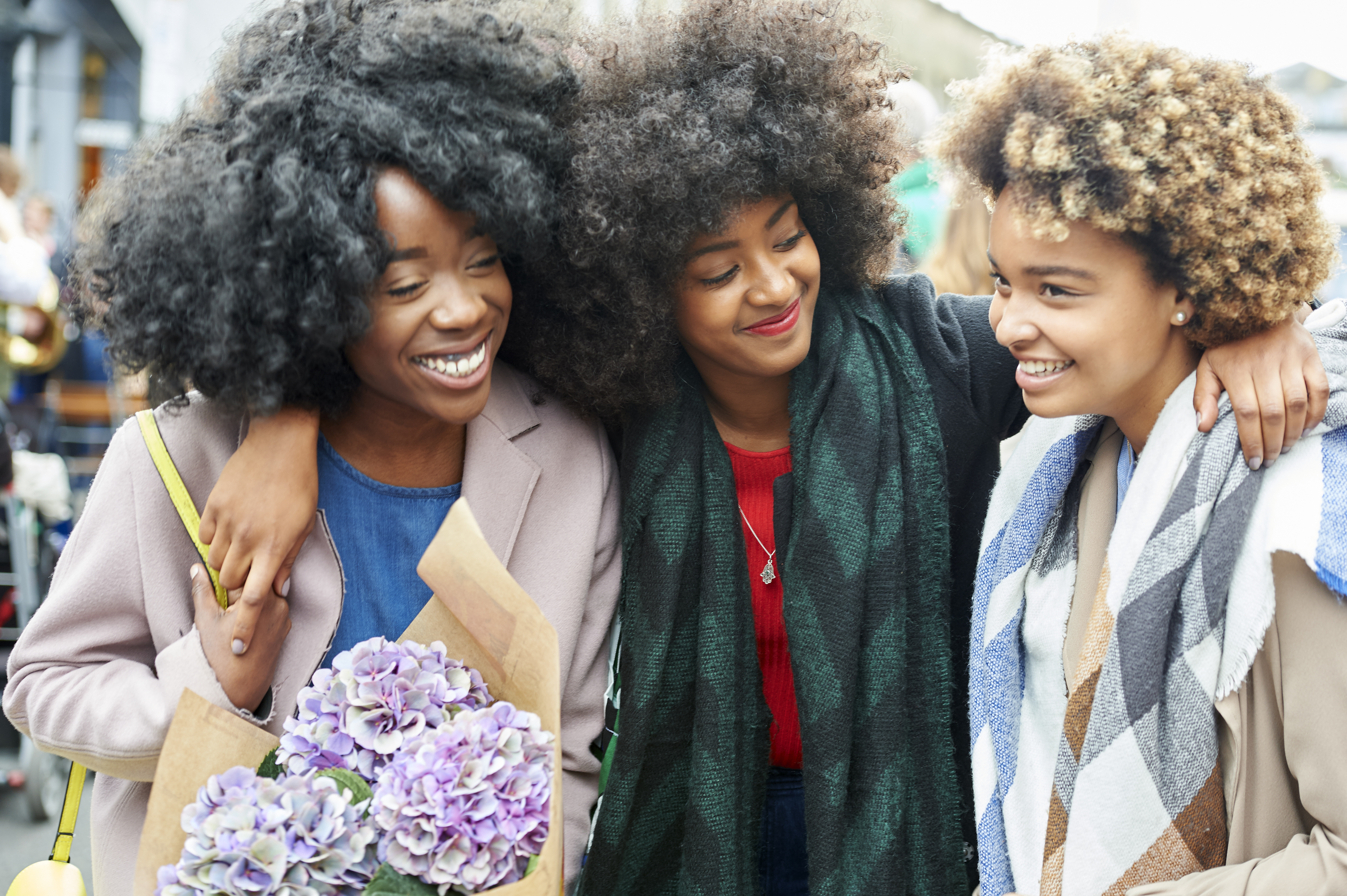 Friends shopping at a flower market.
