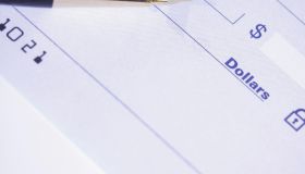 Pen over a blank check