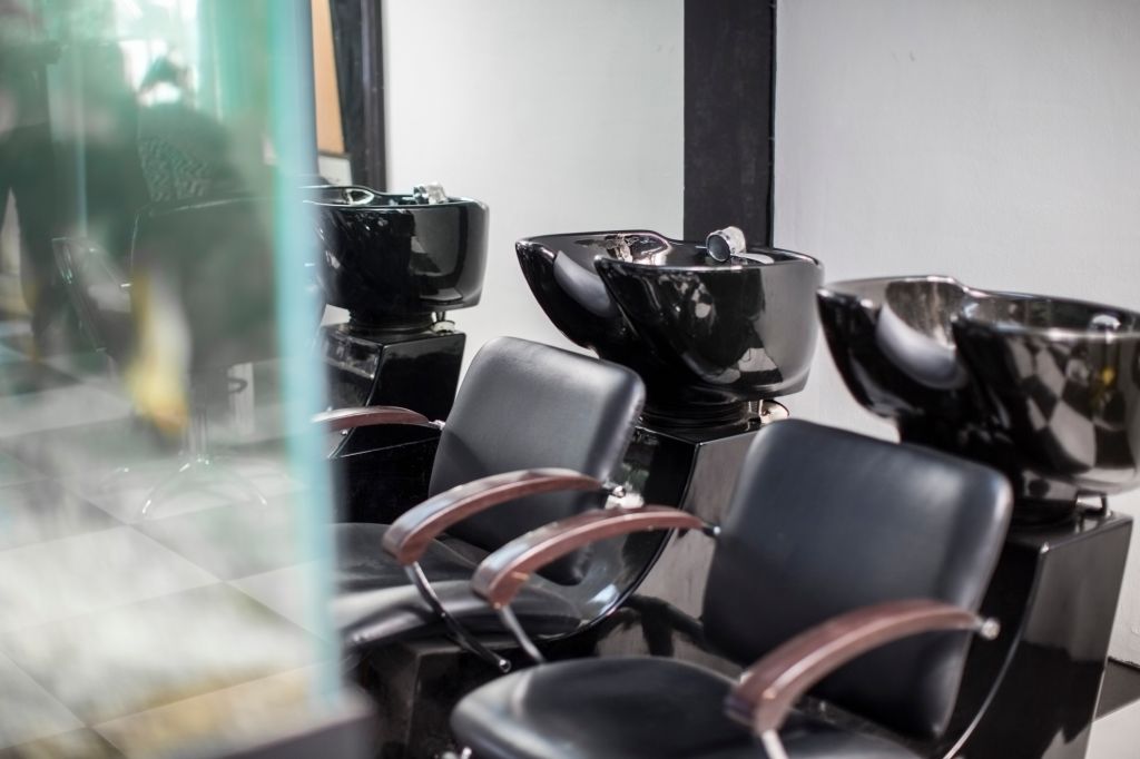 Empty chairs and basins in barbershop