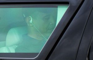 US President Barack Obama uses headphone