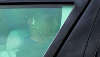 US President Barack Obama uses headphone