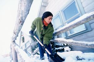 Woman Shoveling Snow