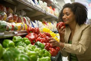 Woman holding red pepper