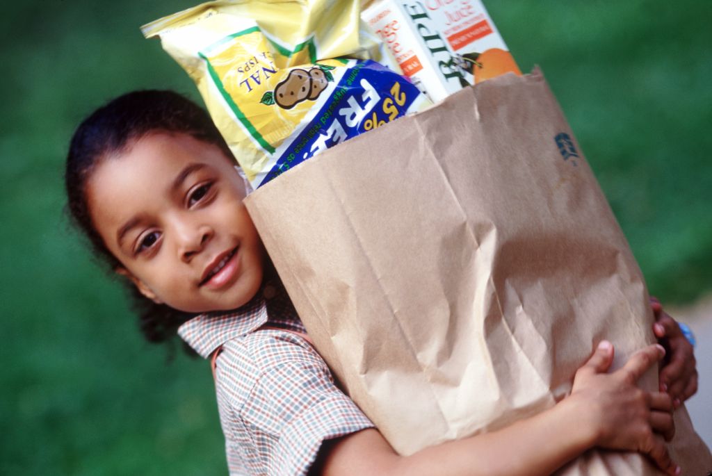 Child carrying groceries