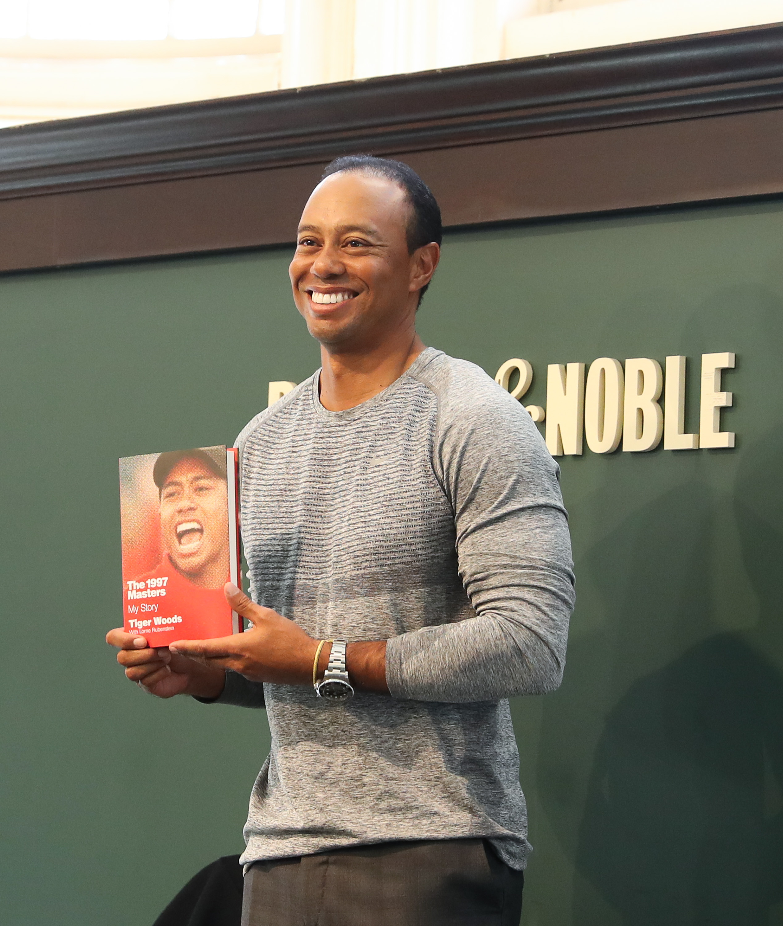 Tiger Woods Signs Copies Of His New Book 'The 1997 Masters: My Story'