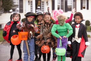 Children (4-7) dressed up for Halloween, group portrait