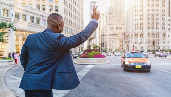 Businessman Hailing a Cab in Downtown Chicago