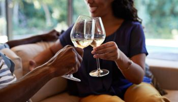 Couple toasting in wine