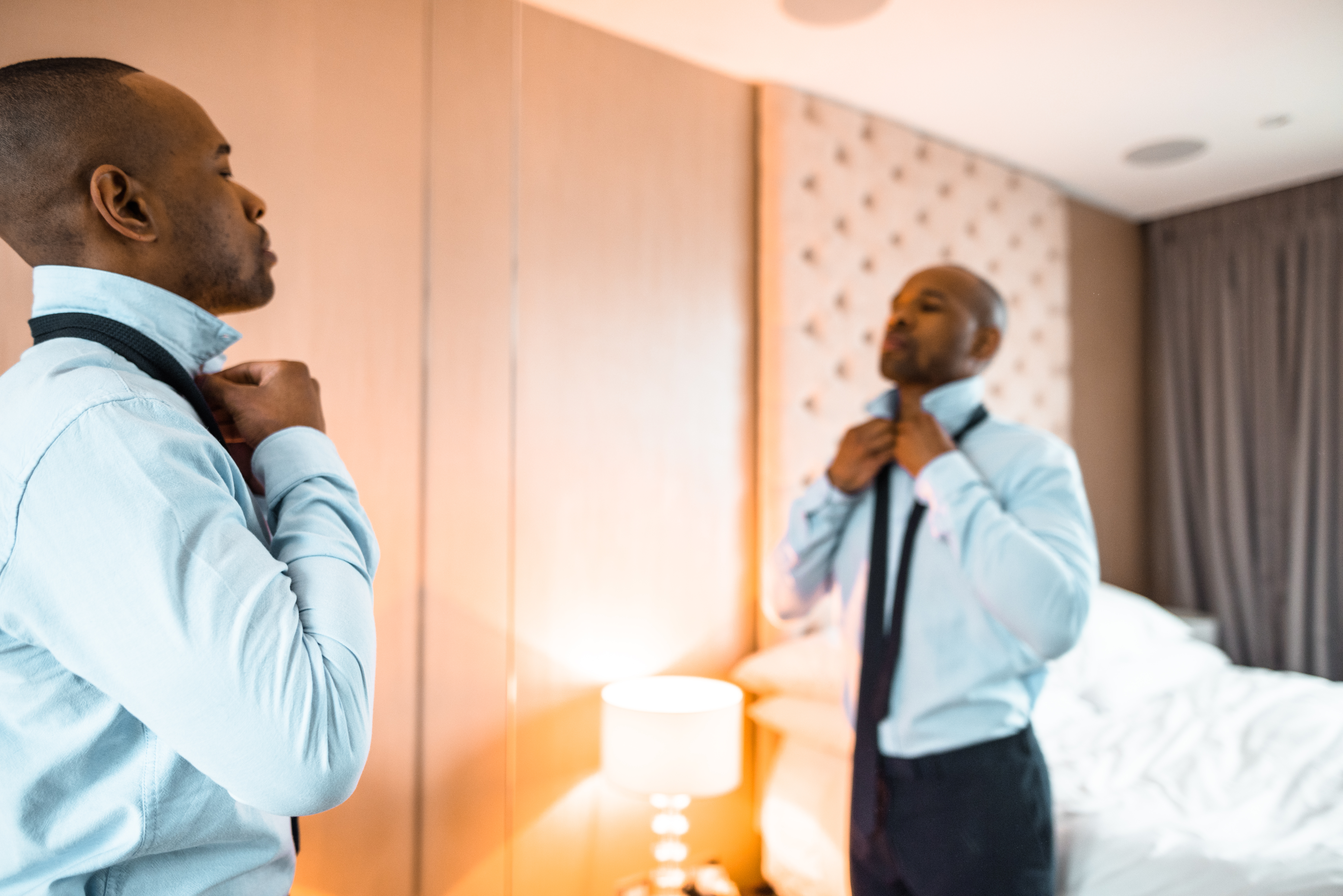businessman dressing up sitting on the bed