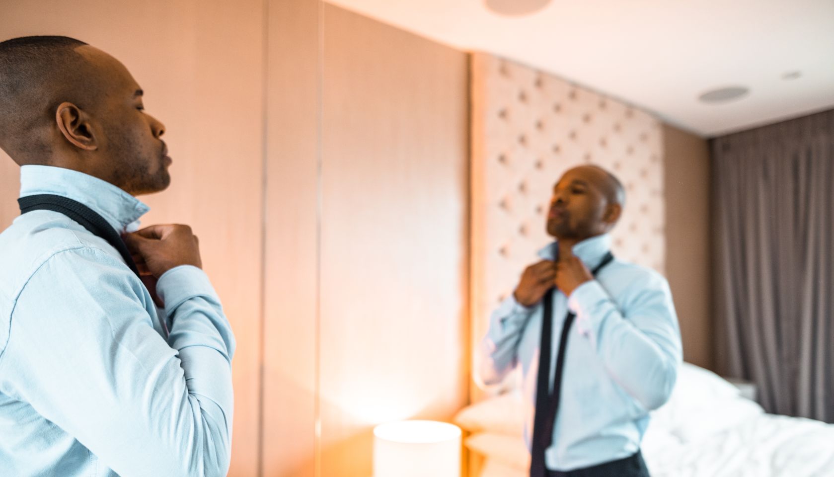 businessman dressing up sitting on the bed