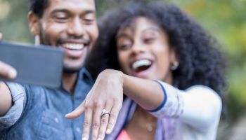 Young woman shows off engagement ring