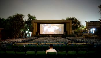 Only one customer can be found in the outdoor cinema El Rubos, Giza whilst watching the recent action film Kaos. Cinema audiences are still strong in Egypt but many prefer to use the new cinema multiplexes or larger indoor cinemas