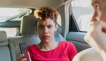 Angry Millennial Passenger Shows Lost Driver Mobile Phone Miami USA