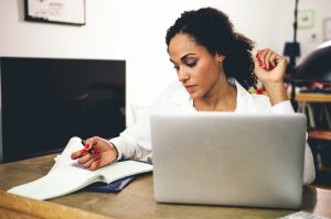 Woman working from home using laptop