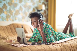 Young woman is listening music online