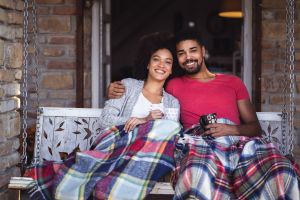 Couple in love enjoying on the porch swing
