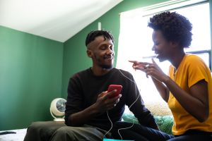 Lovely afro american couple spending happy time together at home