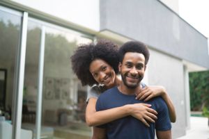 Portrait of a african ethnicity couple smiling outdoors