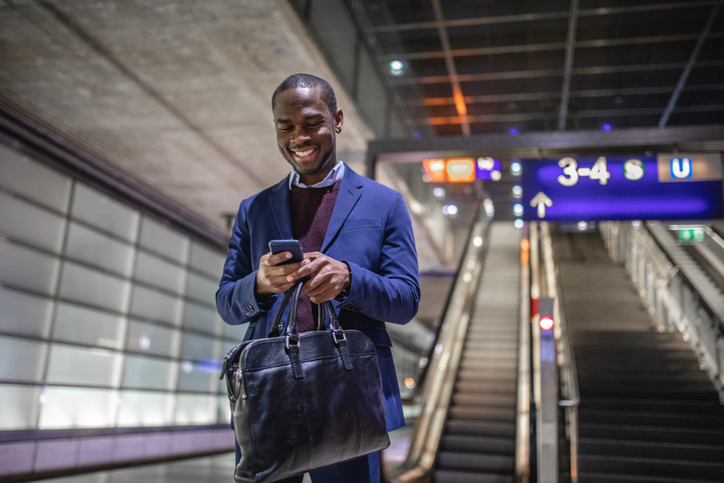 Handsome businessman waiting for his train