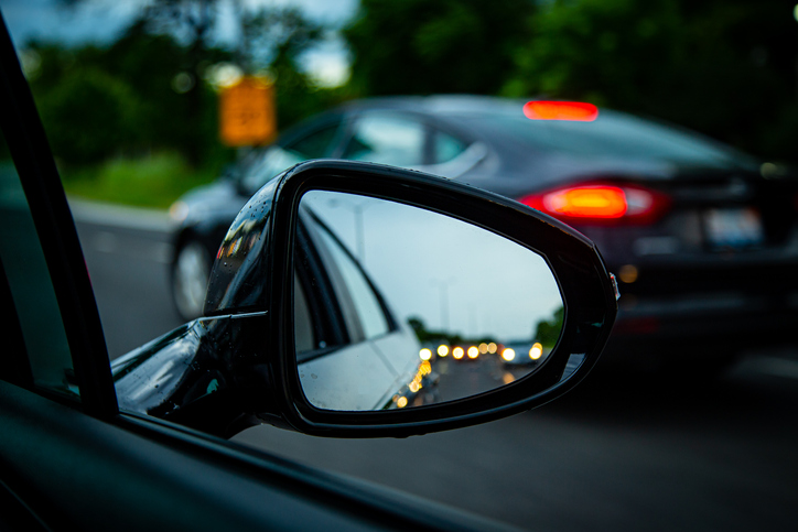 Close-up of a wing mirror in a traffic jam, United States