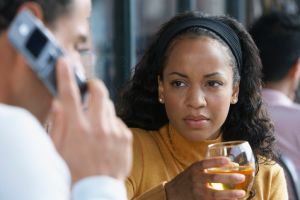 Woman Looking at Man Talk on Cellular Phone