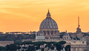St Peters Basilica and skyline with church cupolas, Vatican, Rome, Italy (Sunset)