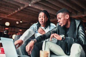 African Couple Solving Freelance Work Problems