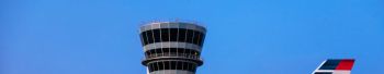Air traffic control tower at busy airport...