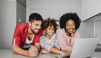 African American family using laptop