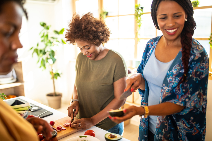 Girlfriends making lunch together
