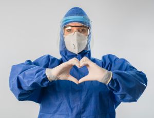 Doctor making heart shape and sending love during coronavirus COVID 19 novel corona virus outbreak