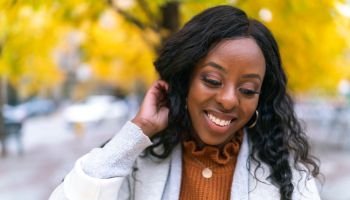 Portrait of beautiful young adult black woman outdoors