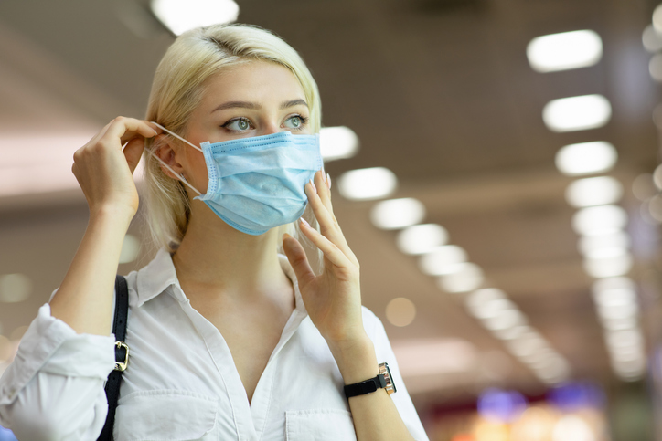 Woman wearing medical mask in shopping center