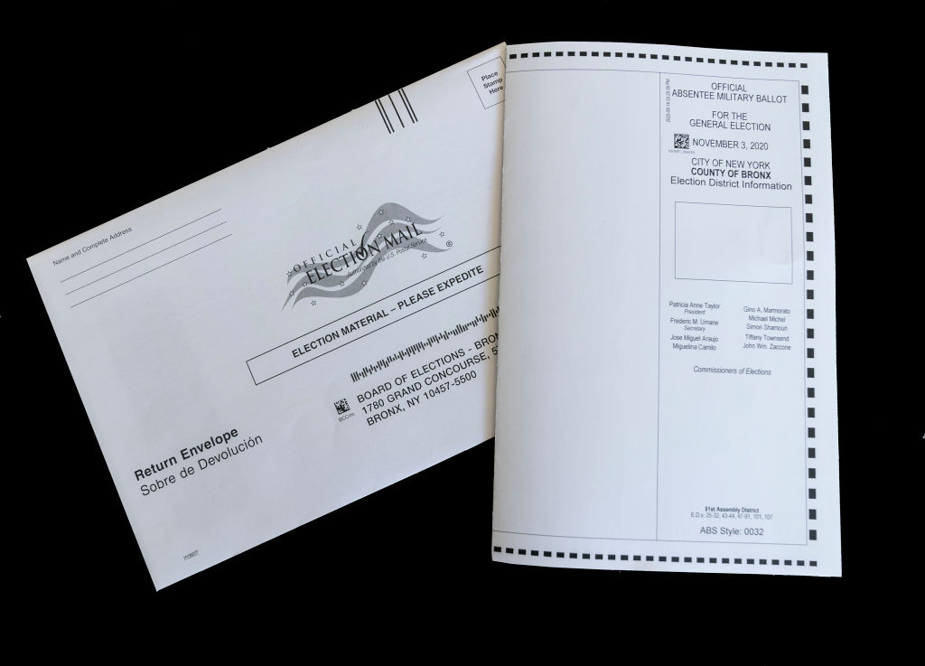 In this photo illustration an absentee mail-in ballot for...