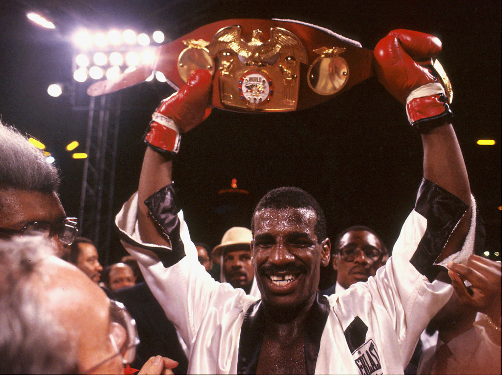 Boxer Leon Spinks defeats Larry Holmes for title
