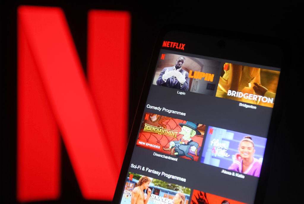In this photo illustration the Netflix logo seen displayed...
