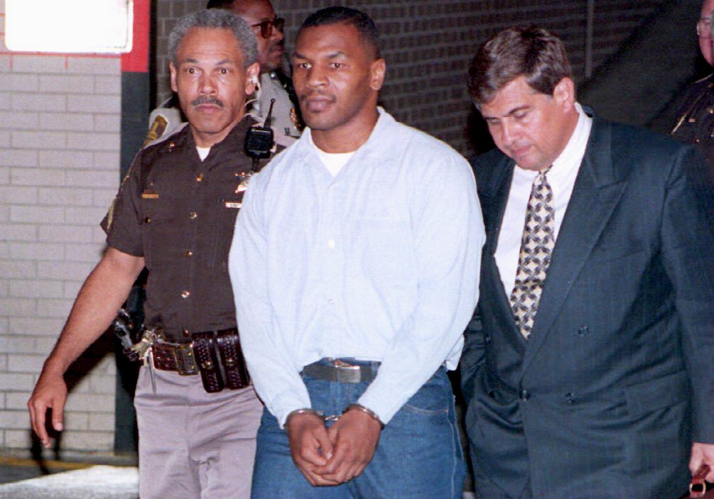 Convicted rapist Mike Tyson (C) leaves t