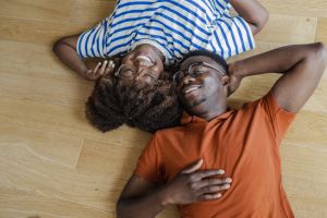 Young couple lying on the floor