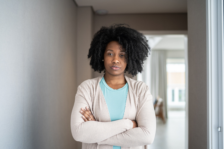 Portrait of a serious mid adult woman at home