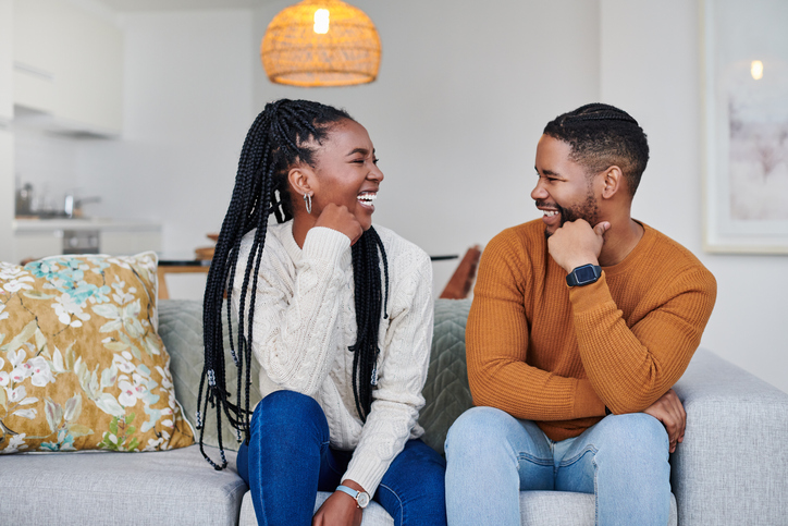 Shot of an affectionate young couple relaxing together at home